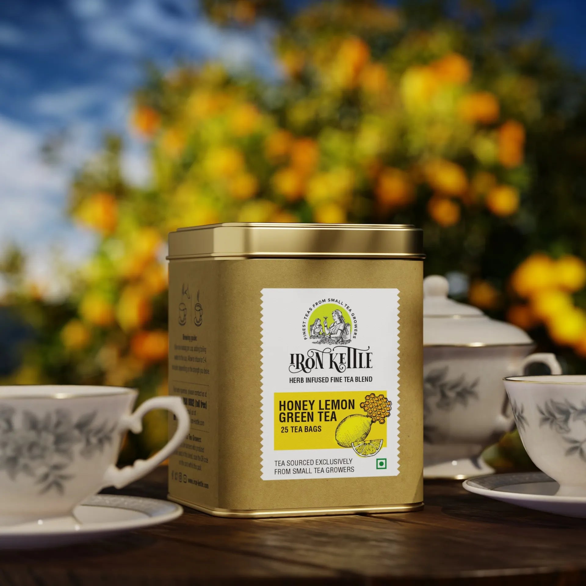 Honey Lemon Green Chai tin placed outdoors with teacups, highlighting a calming tea moment with this aromatic green tea infusion.